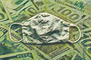 Superimposed 100 dollar bill & facemask