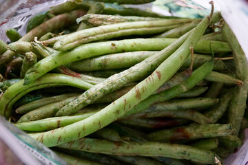 Close up of rotten green beans in a pile