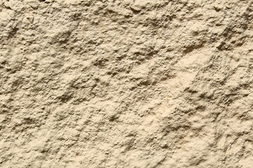 Texture abstract, stone uneven wall dirty yellow