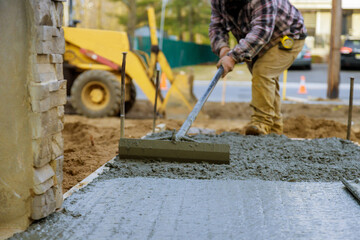 Truck mixer pouring concrete cement for construction sidewalk
