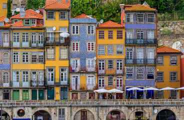 Traditional house facades decorated with Portuguese azulejo tiles in the famous Ribeira neighborhood in Porto, Portugal