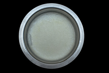 white texture of malai cream made of pure indian buffalo milk in round stainless steel  vessel 