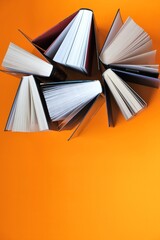 Books set on a orange background.Reading and education concept.books close up. Training and knowledge. top view, copy space.Books page close-up background	