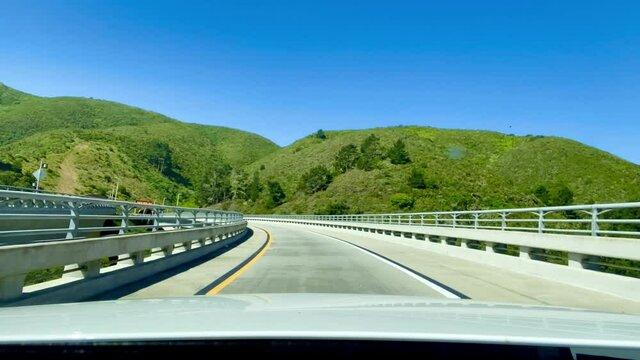 Driving through bridge on Cabrillo Highway. Driving through bridge that leads to tunnel. Bridge to tunnel that connects Pacifica and half Moon Bay, California on Highway 1.