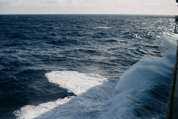 A cruise ship cuts through the waves in the Indian ocean.