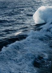 A cruise ship cuts through the waves in the Indian ocean.