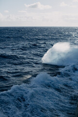 A cruise ship cuts through the waves in the Indian ocean.