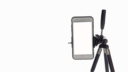 Mobile phone mounted on a tripod with a white background for self-portraits