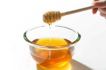 Fresh honey bee in bowl on white background.