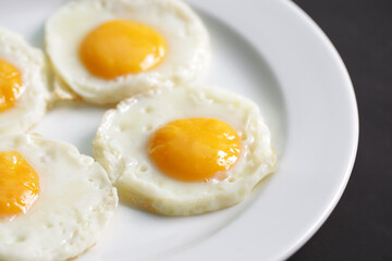 Four fried eggs for healthy breakfast.