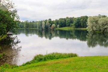 Fototapeta na wymiar View of a lake during a rain in Gatchina park, Russia