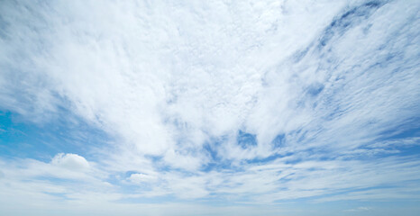 Blue sky background with clouds. Panorama