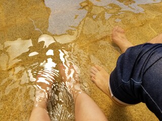 a cuple enjoy foot spa in a spring