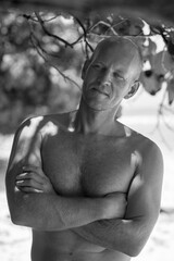 Black&white portrait of Scandinavian bald man with bright eyes.