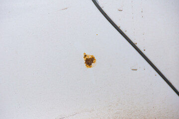 rust stain on the wing of a car