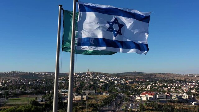 Flag of Israel and The Israel Nature and Parks Authority with Jerusalem, Aerial view