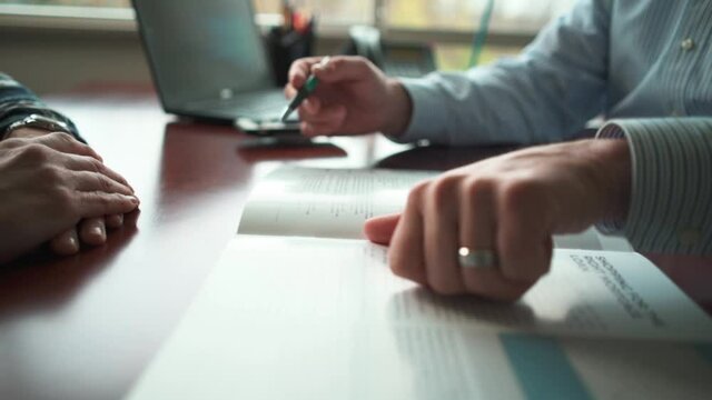 corporate hands explain packet to customer