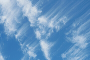 Beautiful wispy cirrus clouds in blue sky on freedom, energize and joyful sunny day