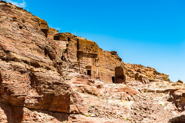 It's Lion Triclinium in Petra (Rose City), Jordan. The city of Petra was lost for over 1000 years. Now one of the Seven Wonders of the Word