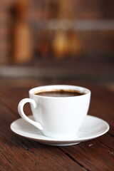 Coffee Cup on wooden plank table