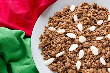 Moroccan Sfouf; a nutty confection of ground fried almonds, ground toasted unhulled sesame seed, and browned flour. Flavored with cinnamon and anise and sweetened with honey or sugar with copy space.