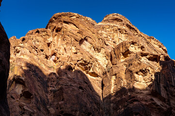 Fototapeta na wymiar It's Canyon in Petra (Red Rose City). The city of Petra was lost for over 1000 years. Now one of the Seven Wonders of the Word