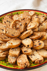 Fekkas are a traditional biscuit from Morocco and one of the most famous food of his gastronomy. Made with raisins and almonds among other tasty ingredients, baked, sliced and roasted. Vertical shot.