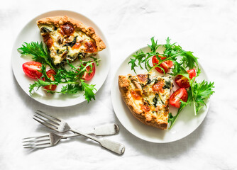 Canned tuna, mozzarella cheese, spinach, potatoes and mizuna tomatoes salad on light background, top view