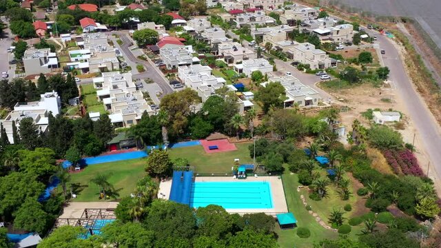 Community swimming Pool with no people due to Corona Virus lockdown, Aerial view.