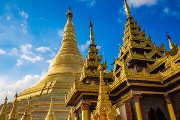 Fototapeta premium Buddhist Pilgrims in the Shwedagon Pagoda at night. It is the most sacred Buddhist pagoda for the Burmese. decoration image contain​ certain​ grain​ noise and​ soft​ focus.