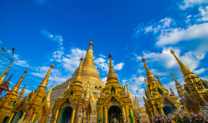 Buddhist Pilgrims in the Shwedagon Pagoda at night. It is the most sacred Buddhist pagoda for the...