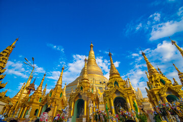 Fototapeta premium Buddhist Pilgrims in the Shwedagon Pagoda at night. It is the most sacred Buddhist pagoda for the Burmese. decoration image contain​ certain​ grain​ noise and​ soft​ focus.