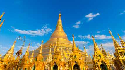 Fototapeta premium Buddhist Pilgrims in the Shwedagon Pagoda at night. It is the most sacred Buddhist pagoda for the Burmese. decoration image contain​ certain​ grain​ noise and​ soft​ focus.