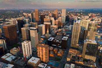 city skyline tall buildings denver sunset