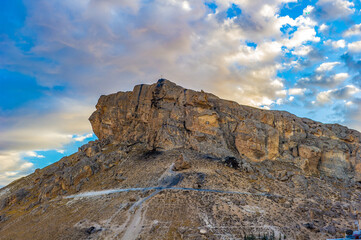 It's Rock in front of the sky on the sunset