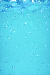 Light blue bubble of alcohol gel. anti COVID 19 background.