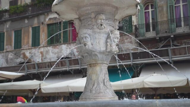 Slowly passing the Cansignorio sculpted base of the Fountain of Madonna Verona, Italy, slow motion