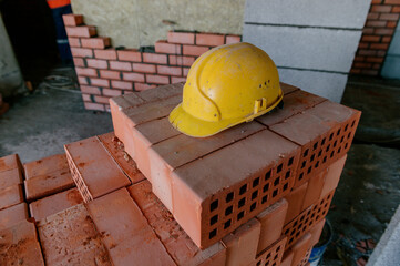 construction helmet and bricks