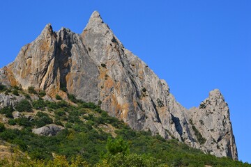 Fototapeta na wymiar A pointed mountain peak in the Crimea