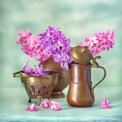 Beautiful bouquet of a spring flowers in a vase on the table. Lovely bunch of flowers .Beautiful pink hyacinths.
