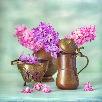 Beautiful bouquet of a spring flowers in a vase on the table. Lovely bunch of flowers .Beautiful pink hyacinths.
