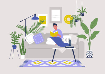 Young male character sitting on sofa and reading a book, cozy boho interior with plants and ethnic decoration, stay at home