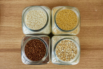 Buckwheat in a glass jar with a spoon, closeup