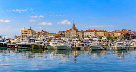 Fototapeta na wymiar Boats in the port and marina by the Old town in Budva Montenegro on the Adriatic Sea
