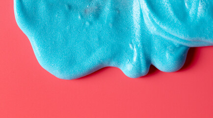 Blue slime isolated on pink background