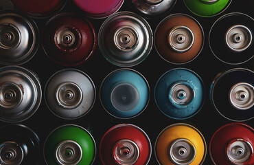 texture of multi-colored spray cans with paint for graffiti, for background and screen saver