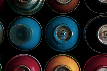 texture of multi-colored spray cans with paint for graffiti, for background and screen saver