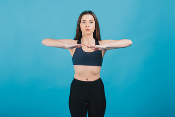 Fototapeta na wymiar sport girl performs workout on blue background
