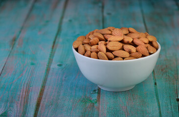 Almond in a cup, placed on a wooden floor for cooking