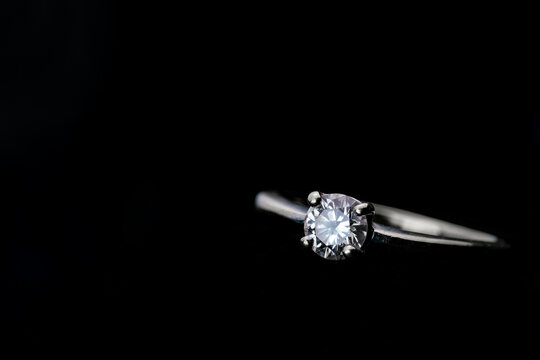 Diamond ring with copy space on black background